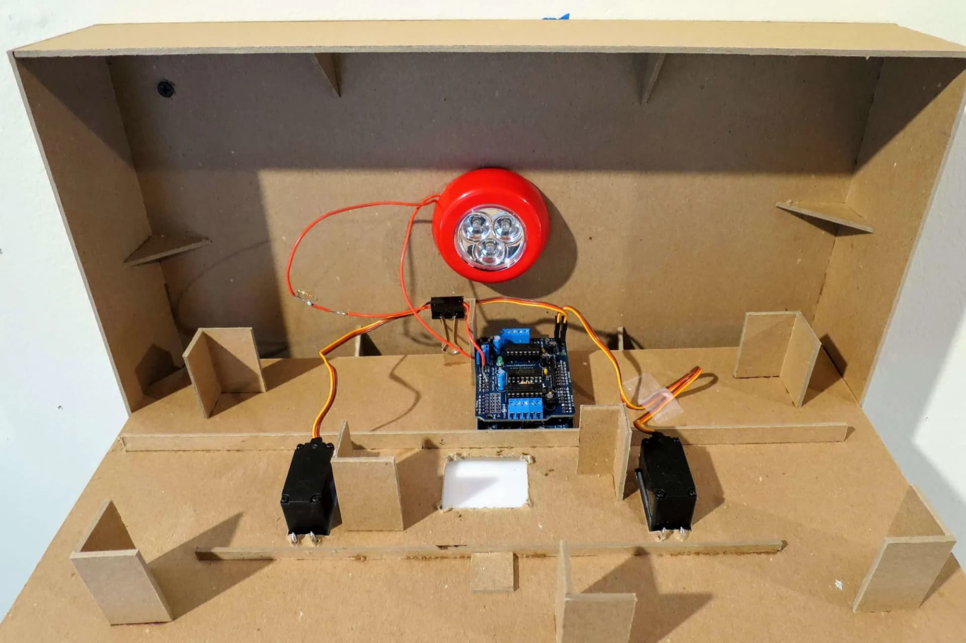 Letters set on the disks that are attached to the servo motors