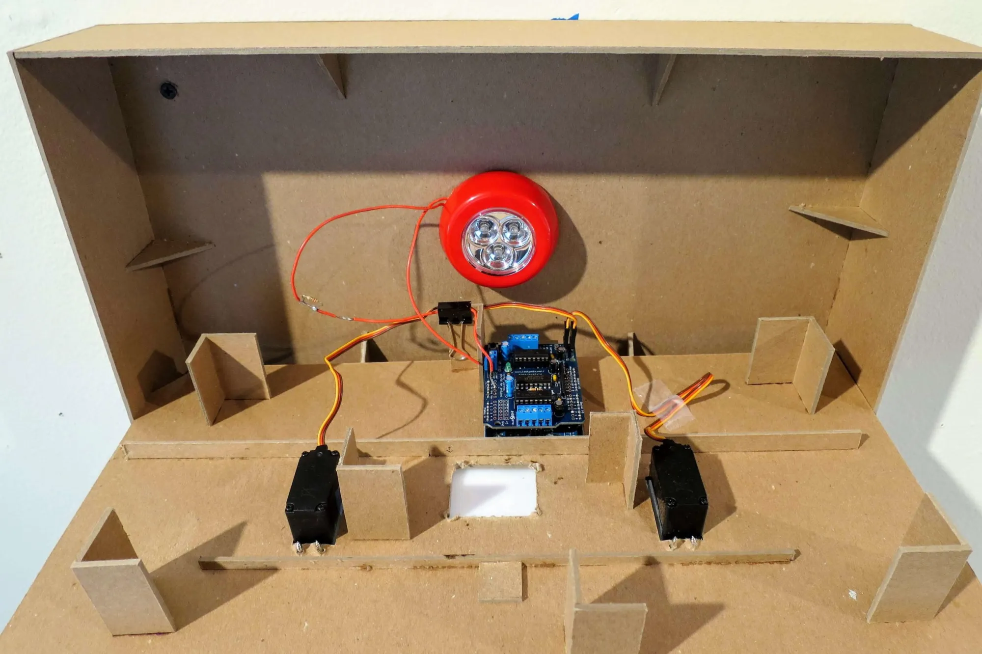 Letters set on the disks that are attached to the servo motors